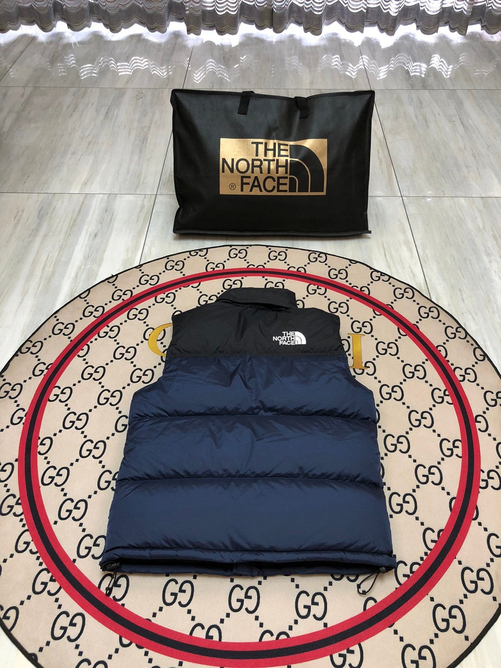 The North Face Puffer Vest in Navy and Black with Stand Collar